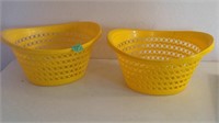 2 yellow laundry baskets