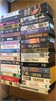 VHS tapes, several new in package.