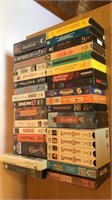 VHS tapes, several new in package.