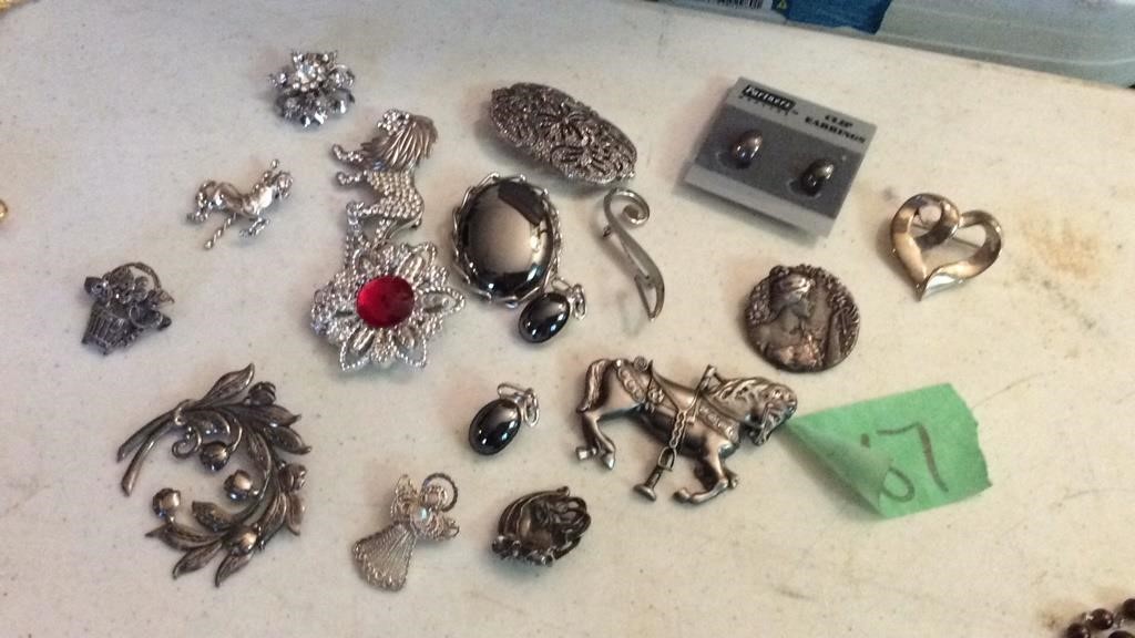 Assorted brooches, earrings and more