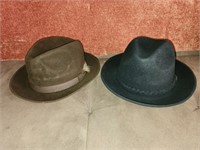 Two Dobbs brand men's hats
