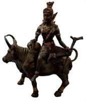 Asian God riding a Cow, possibly Shiva riding