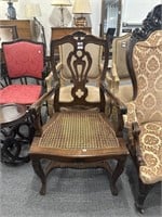 Carved wood armchair