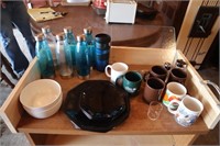Bottles; Cups; Plates; Bowls; Shelf