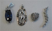 Four Assorted Sterling Silver Pendants