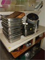 TOP SHELF OF STAINLESS PANS & POTS