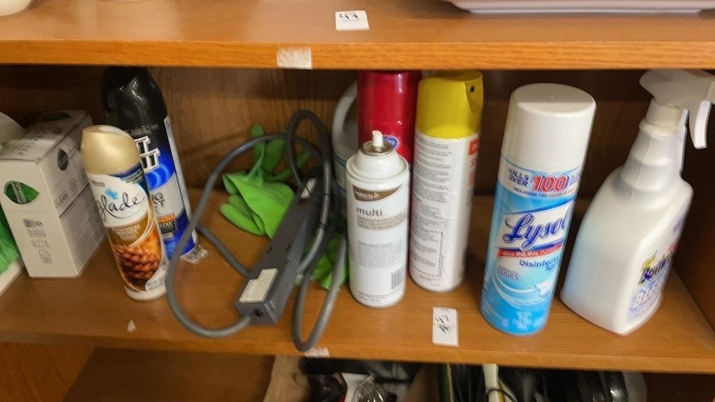 Shelf lot of cleaning products, power strip cord