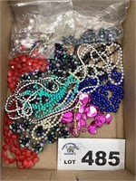 ASSORTMENT OF PLASTIC BEADS AND NECKLACES