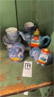 Three elephant figurines, and six tea cups