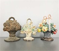3 vintage cast iron flower basket doorstops -