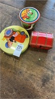 Small tin along with small red toy chest and