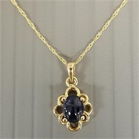 14K pendant necklace set with cabochon sapphire