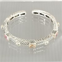 Hinged sterling silver cuff bracelet set with