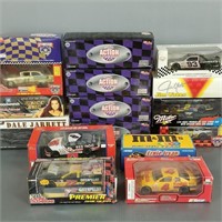 16 assorted diecast Nascar model cars in boxes