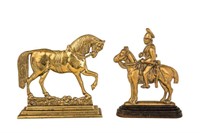 TWO ANTIQUE BRASS HORSE-FORM DOOR STOPS