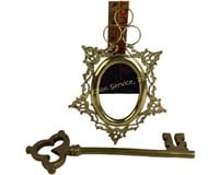 Large decorative brass key, brass mirror