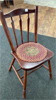 Wood chair with woven seat cover, possibly maple