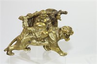 A Bronze Lion Riding Buddha