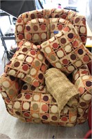 Vintage Recliner with Pillows and Knitted Blanket