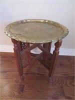 An Etched and Carved Copper and Teak Tray Table