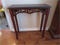 A Walnut Finish Console Table With Pierced Skirt