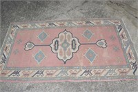 AREA RUG 80-" BY 45"