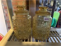 2 LARGE AMBER GLASS CANISTERS WITH PLASTIC LID