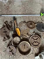 Group lot of cast iron stove parts.