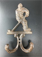 Cast iron hockey player wall hook. It is brand new