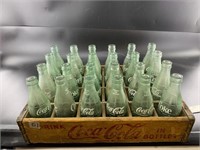 Antique Coca Cola carrier with mixed Coca Cola gla