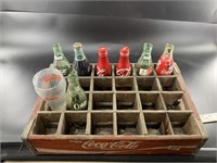 Mixed Coca Cola bottles and cups and Radio and a C