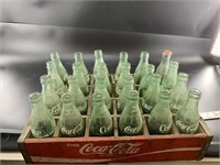 Antique Coca Cola carrier with mixed Coca Cola gla