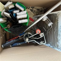 Box of paint brushes, rollers, paint sprayer.