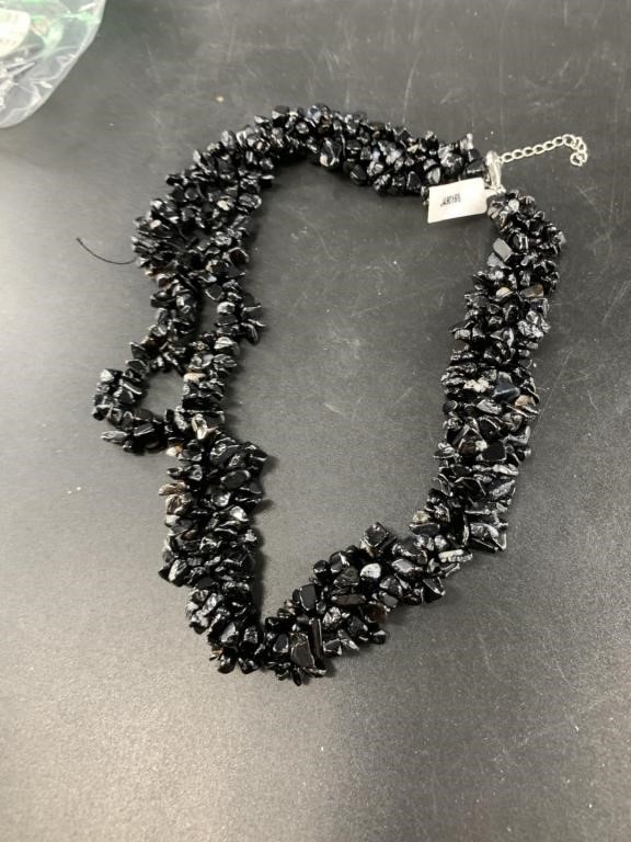 Heavy onyx necklace with separating threads, all o