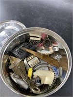 Tobacco tin full of bits and bobs including a Wesc