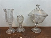 2 cases and a stemmed candy compote with lid