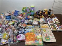 Box of McDonald’s toys and bags, snoopy tins and