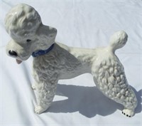 Vintage porcelain poodle with blue collar statue.
