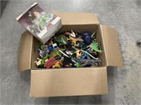 Box of misc toys & porcelain doll