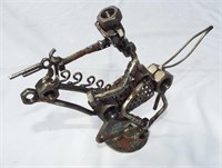 Steampunk Statue-made of nuts, bolts, nails, etc.