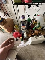 Shelf and Contents, Gas Can, and Saw