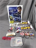 Jimmie Johnson tin sign, NASCAR cards, NASCAR cars
