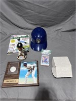 Various baseball collectibles:  cards, helmet, pla