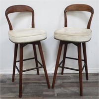 Pair of mid century modern swivel bar stools