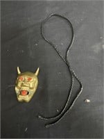 Bennett brass & copper demon mask bolo tie