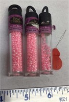 F11) PINK BEADS AND A THREADER