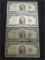 Four $2 Red Seal US paper money bills