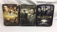 F9)  DVDs. Deadwood seasons, one, two and three.