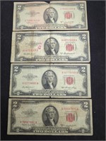 Four $2 Red Seal US paper money bills