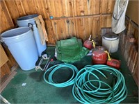 Garden hose, gas, cans, tarp, trash, cans,